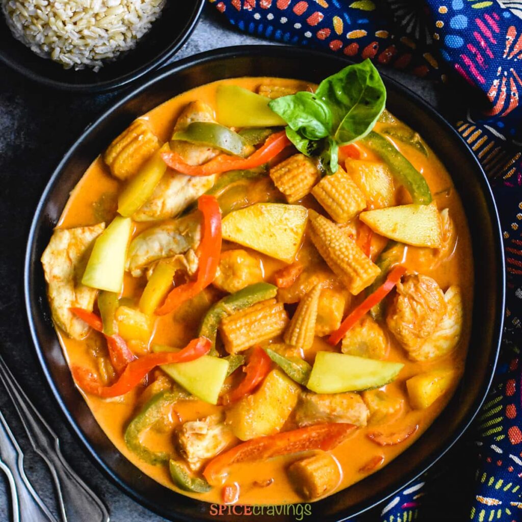 Mango Chicken Recipe with peppers in a pot